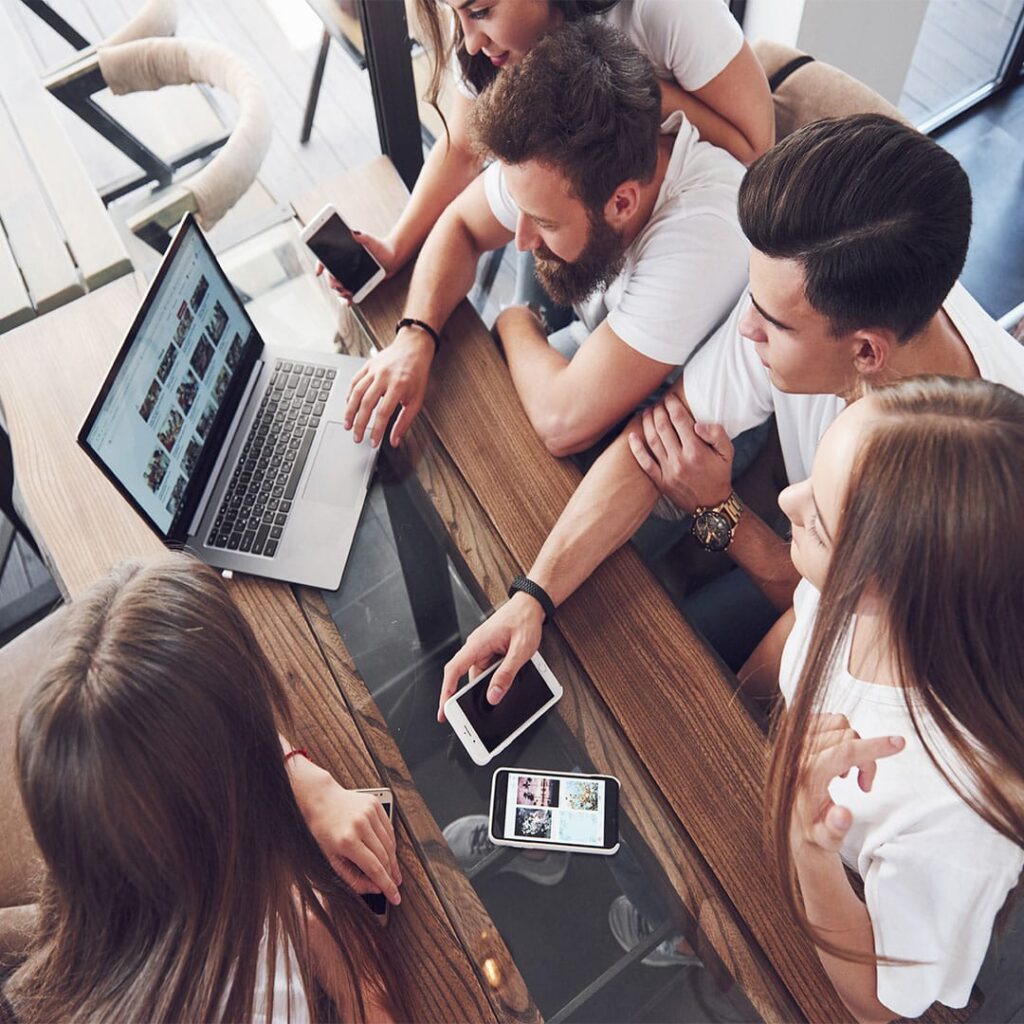 Principles of Website Design: 2025 UX Trends 40 a group of young people with gadgets and a laptop 2023 11 27 04 53 17 utc