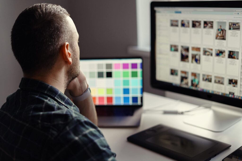 How to Choose a Web Design Agency: 2026 Guide 46 modern man working remotely on a computer from hom 2026 03 10 03 21 27 utc scaled 1